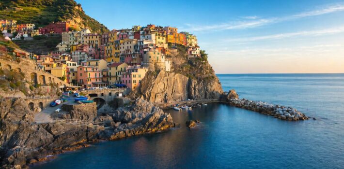 Colorful seaside village on Ligurian coast Italy with cliffs and Mediterranean sea view